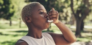 Woman using inhaler