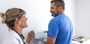 doctor weighing patient