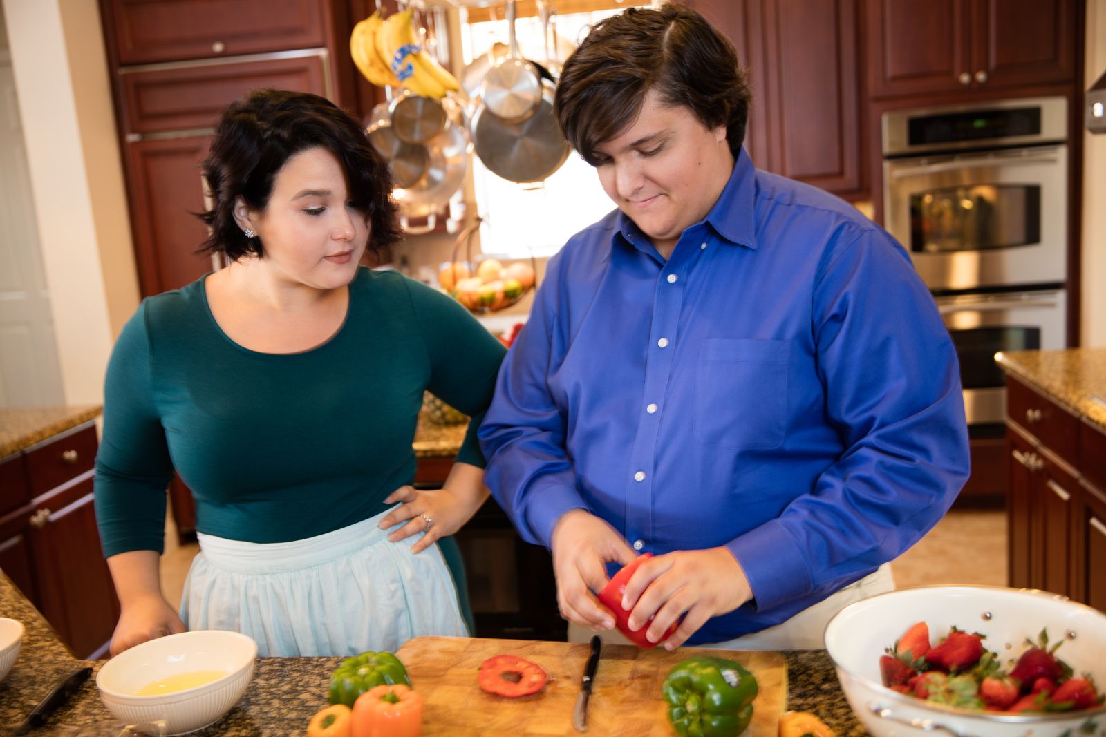 Two people cook a nutritious meal together to maintain a healthy body weight