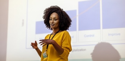 A woman delivers a diabetes conference presentation