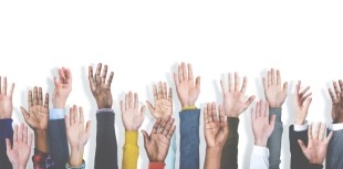 group of people raising hands