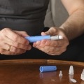 Man preparing diabetes drug injection